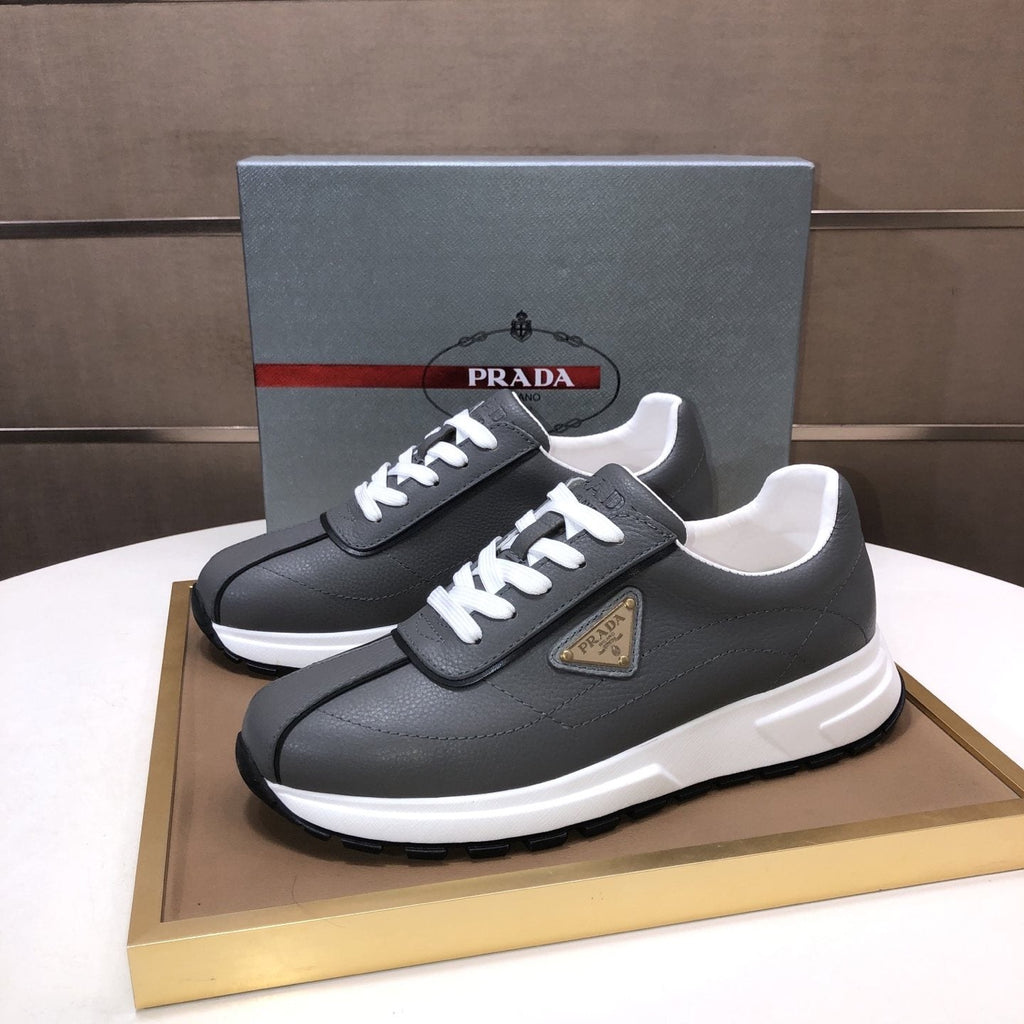 Prada Triangle Plaque Low-Top Sneakers - Triangular Side Plaque Detail